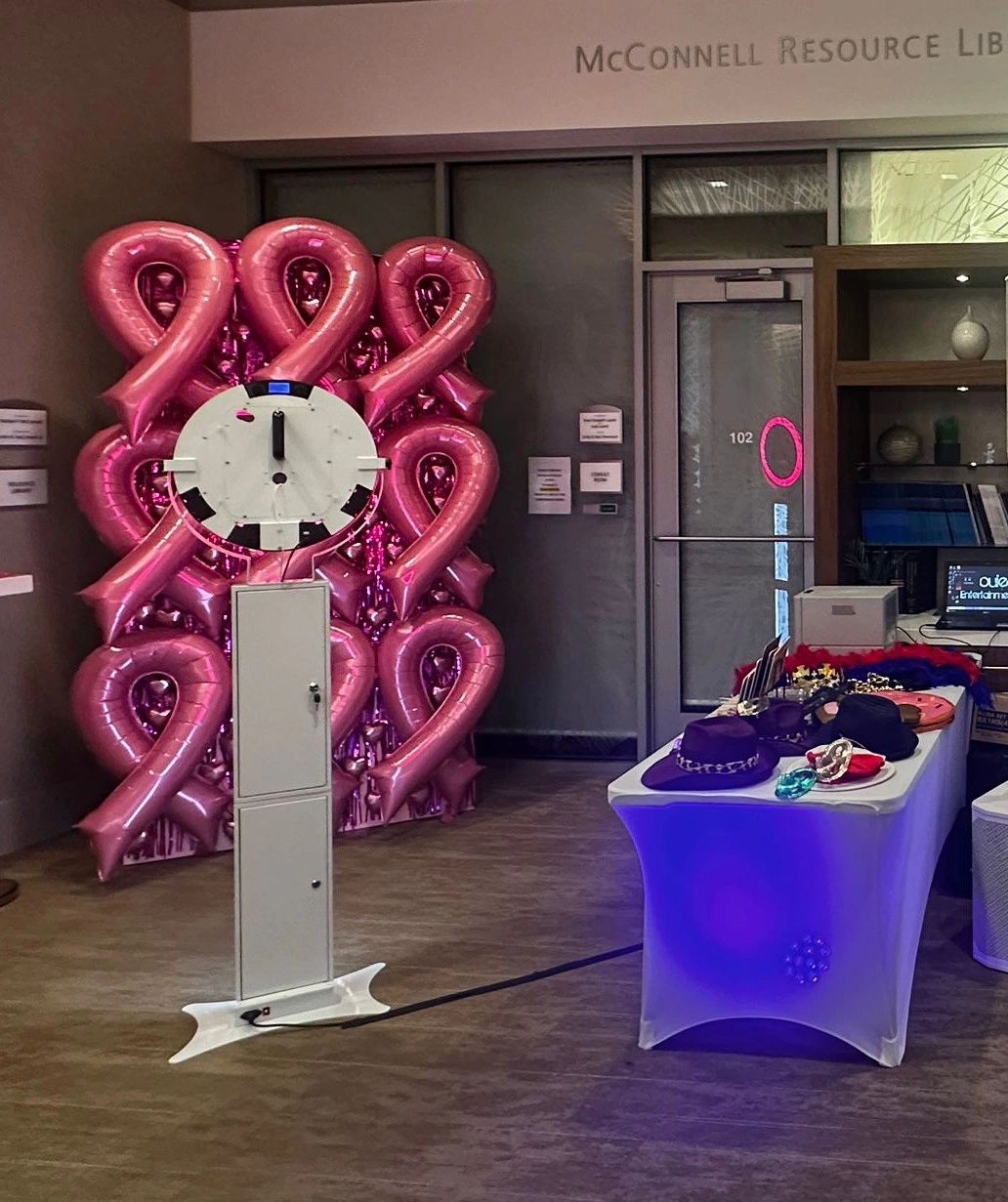 Open-air photo booth setup with props at a Treasure Coast celebration