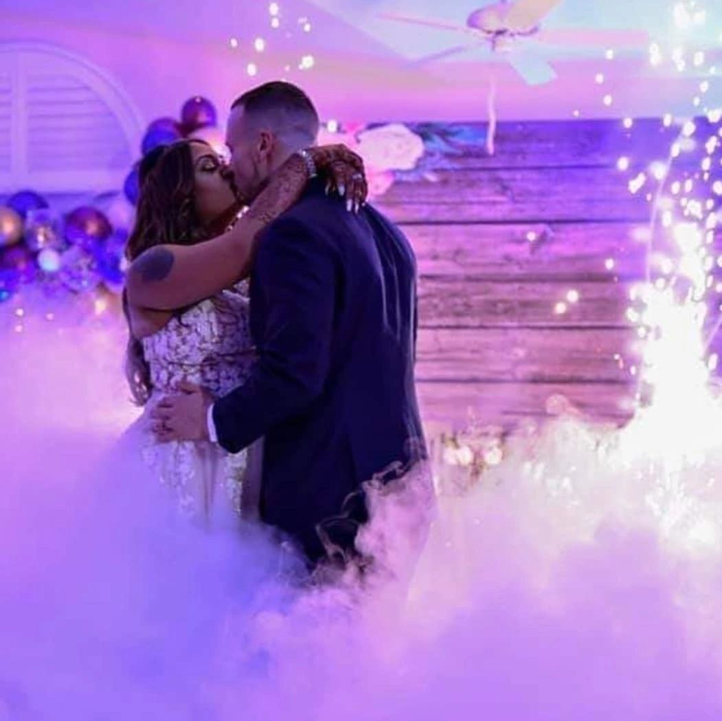 Newlyweds share a first kiss on the dance floor at a DJ Louie G wedding